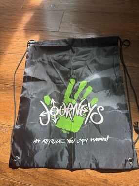 Journeys Black Drawstring Backpack with Green Handprint Graphic